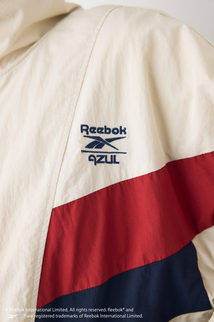 【REEBOK×AZUL】ナイロントラックジャケット IVOY M