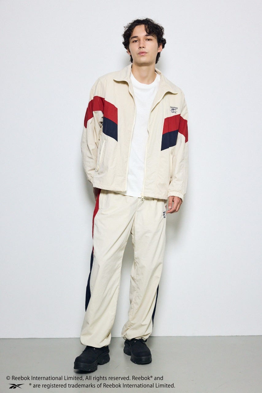 【REEBOK×AZUL】ナイロントラックジャケット IVOY M