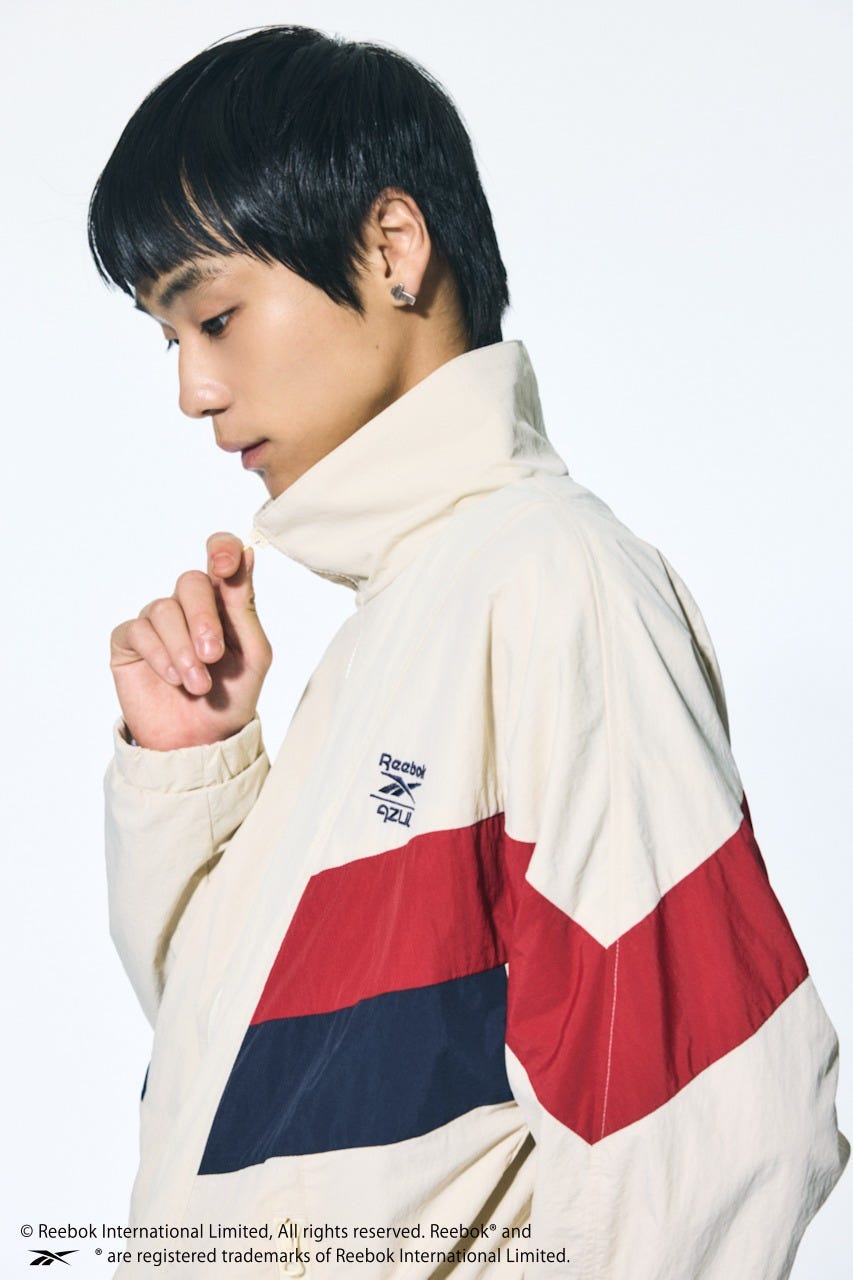 【REEBOK×AZUL】ナイロントラックジャケット IVOY M
