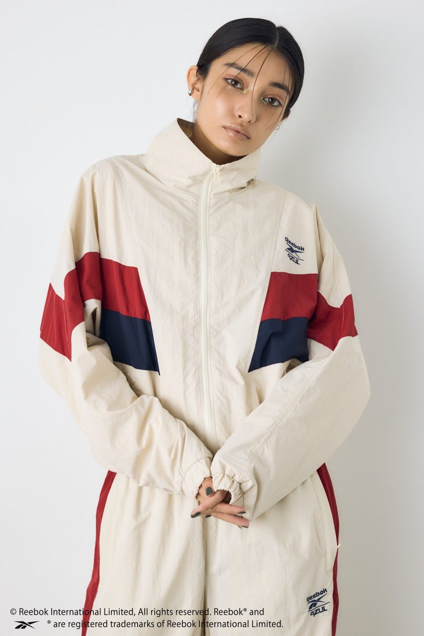 【REEBOK×AZUL】ナイロントラックジャケット IVOY M