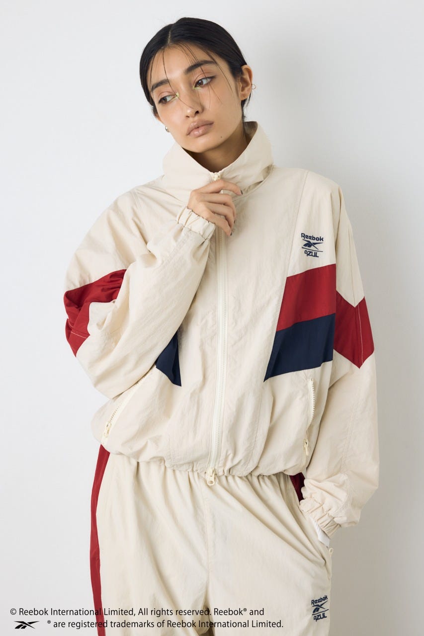 【REEBOK×AZUL】ナイロントラックジャケット IVOY M