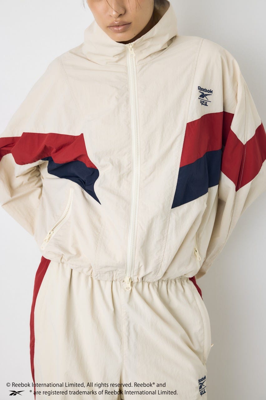 【REEBOK×AZUL】ナイロントラックジャケット IVOY M