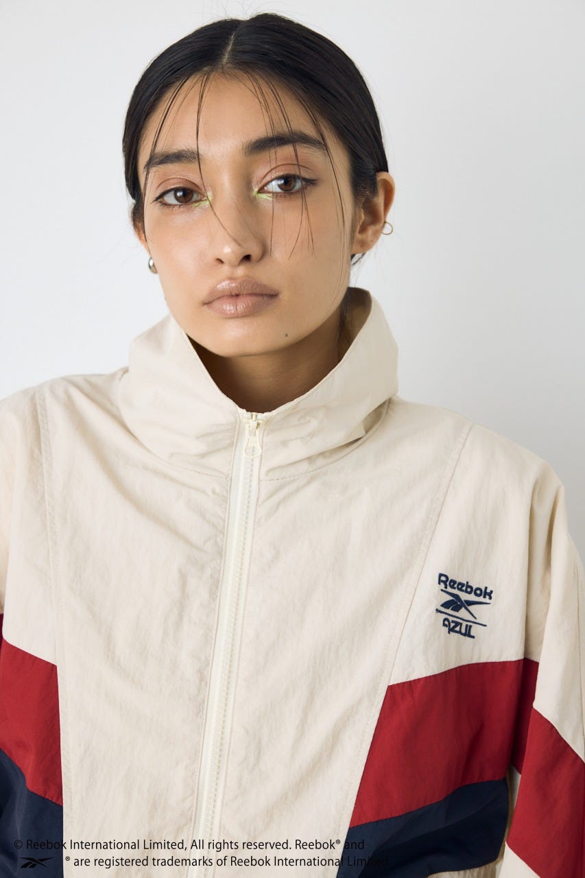 【REEBOK×AZUL】ナイロントラックジャケット IVOY M