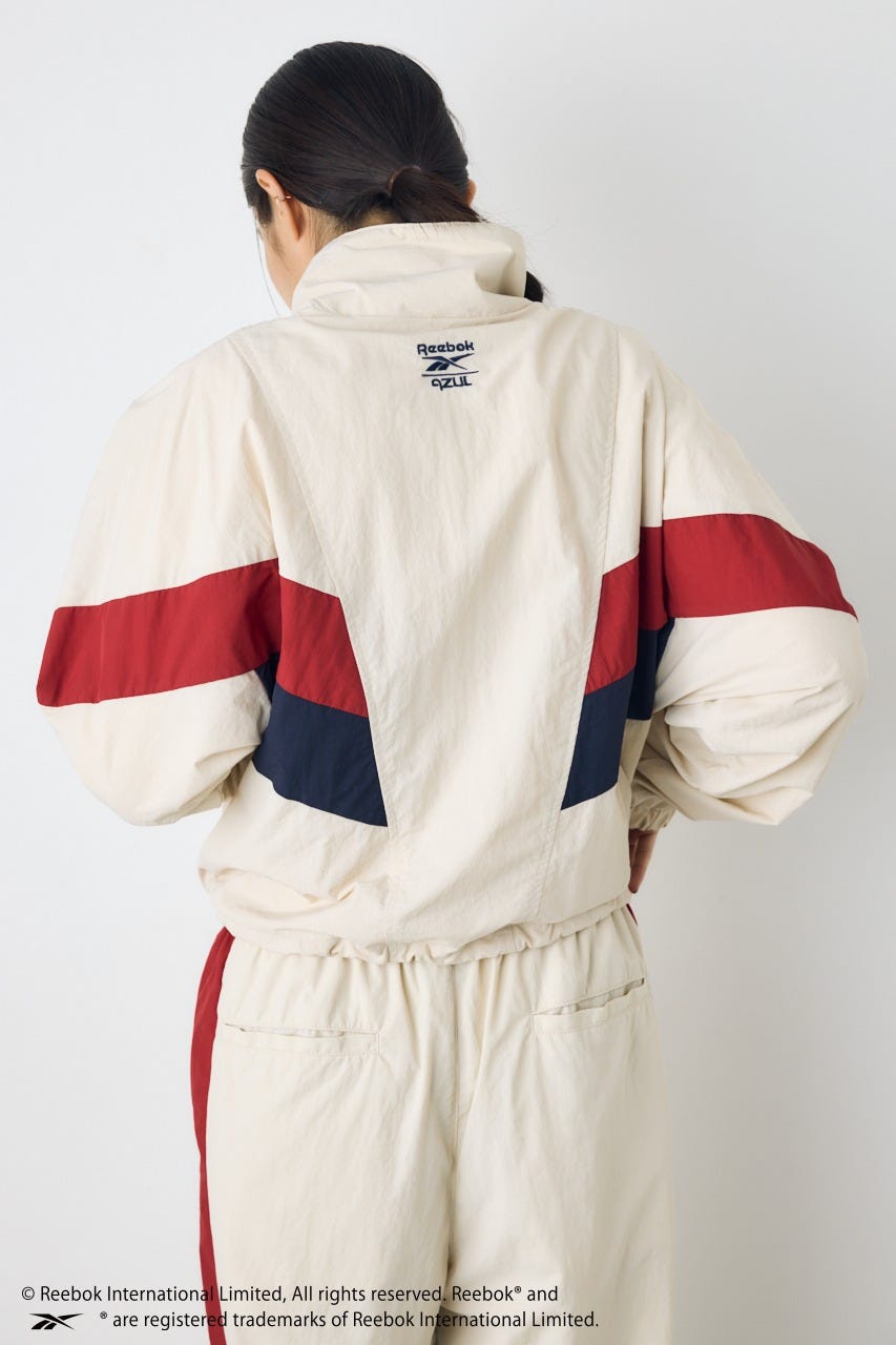 【REEBOK×AZUL】ナイロントラックジャケット IVOY M