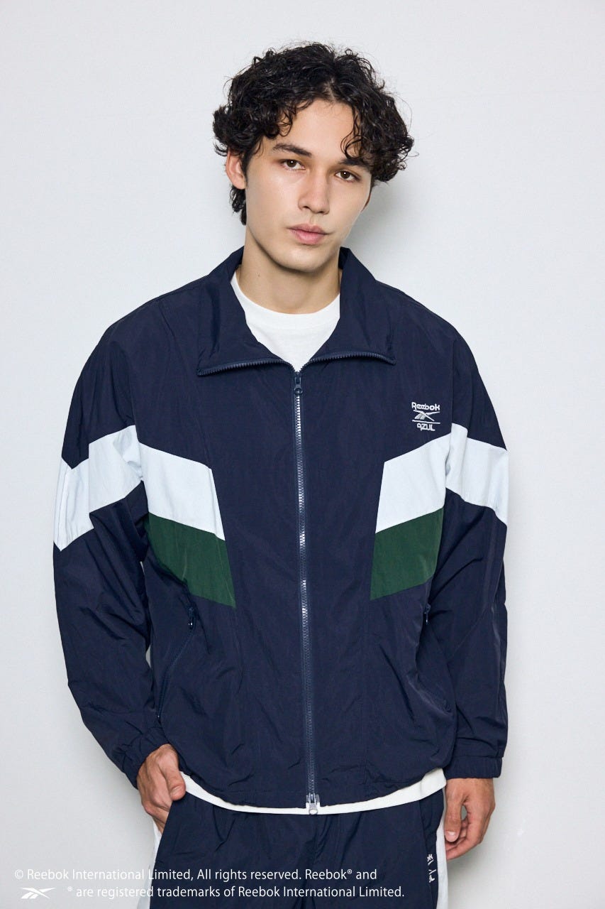 【REEBOK×AZUL】ナイロントラックジャケット NVY L