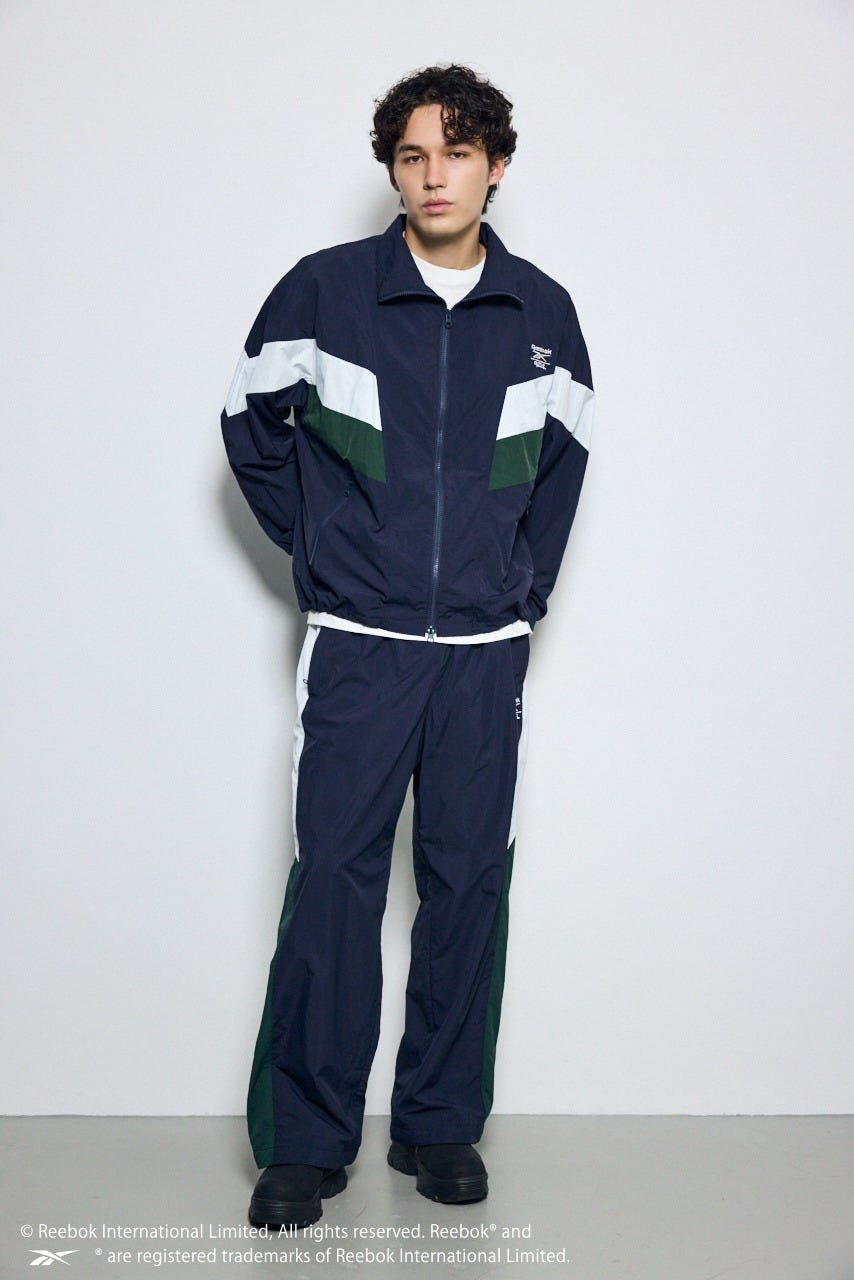 【REEBOK×AZUL】ナイロントラックジャケット NVY L